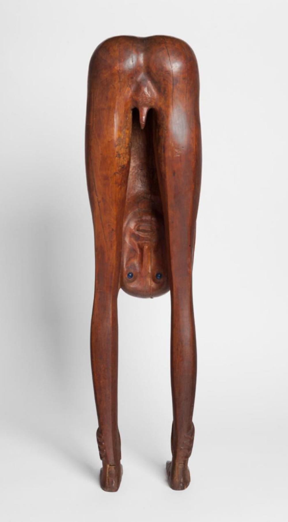 Boy Looking through Legs, image 1