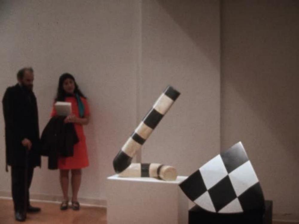 Isamu Noguchi at exhibition opening for "Isamu Noguchi," Cordier & Ekstrom, Inc., New York, November 4, 1970–November 28, 1970. 1 of 2.