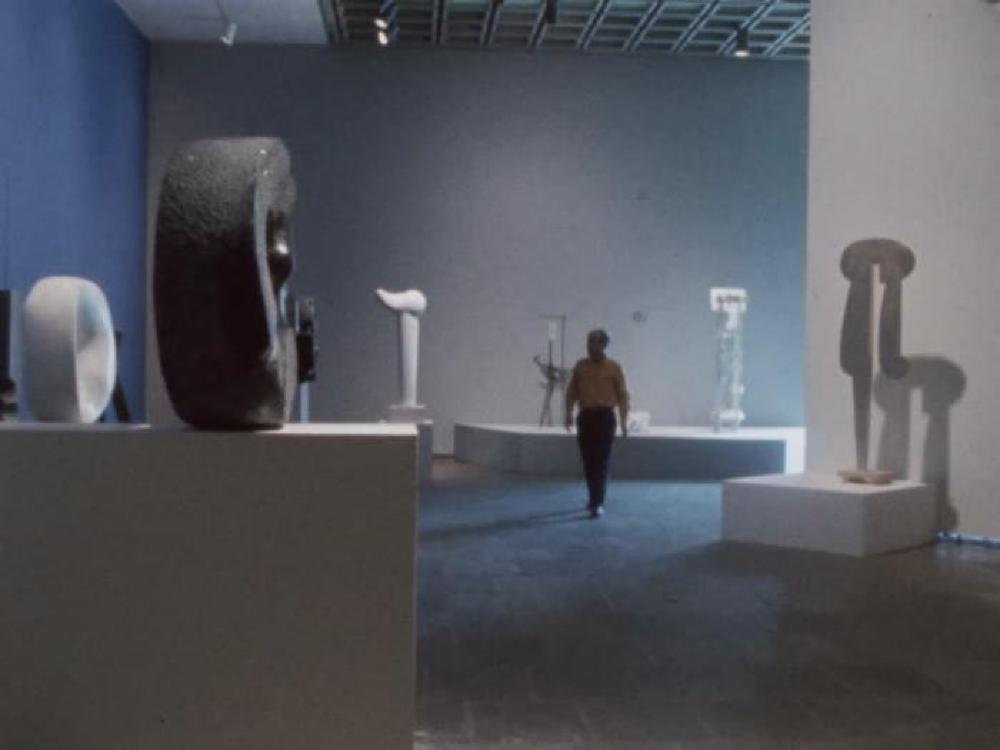 Exhibition footage of "Isamu Noguchi," at the Whitney Museum of American Art, April 17 – June 16, 1968. Footage of Red Cube, 140 Broadway, New York and Sunken Garden, Chase Manhattan Bank Plaza, New York. Courtesy of The Noguchi Museum Archives, AV_F16_036_c1970. ©The Isamu Noguchi Foundation and Garden Museum, New York / Artists Rights Society [ARS]