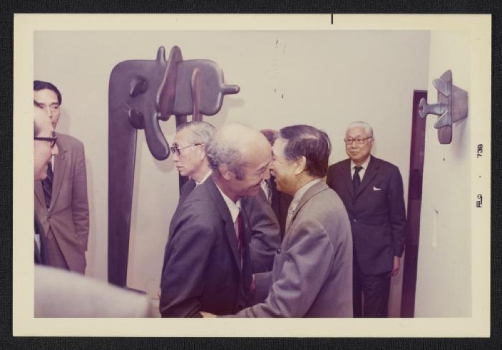 Noguchi with unidentified guest in front of Avatar, Exhibition Opening, Minami Gallery, 1973
