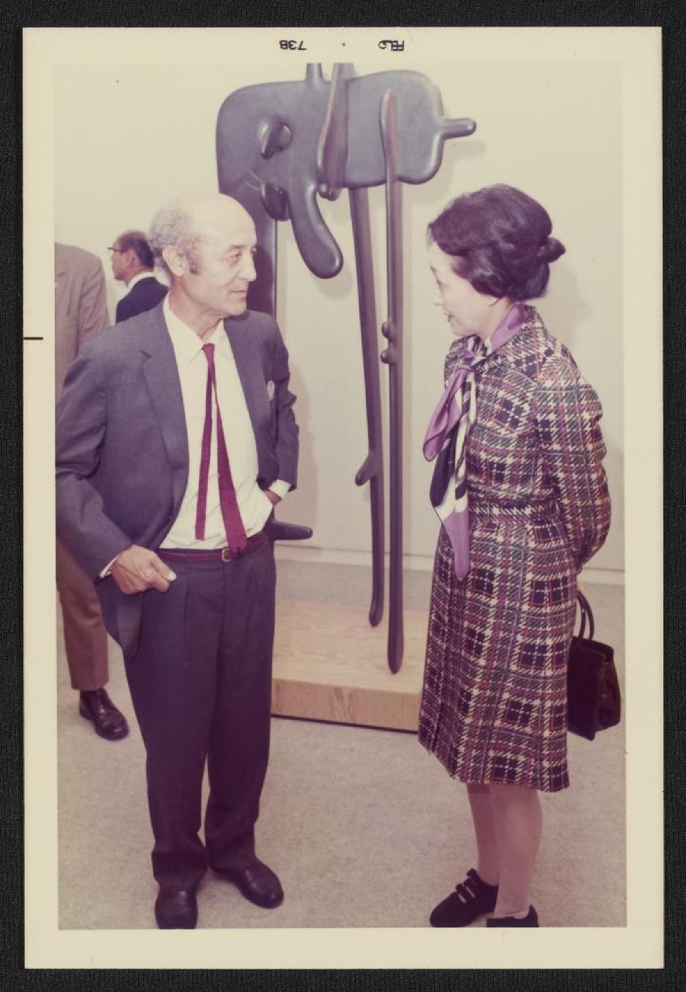 Noguchi with guest in front of Avatar, exhibition opening, Minami Gallery, 1973