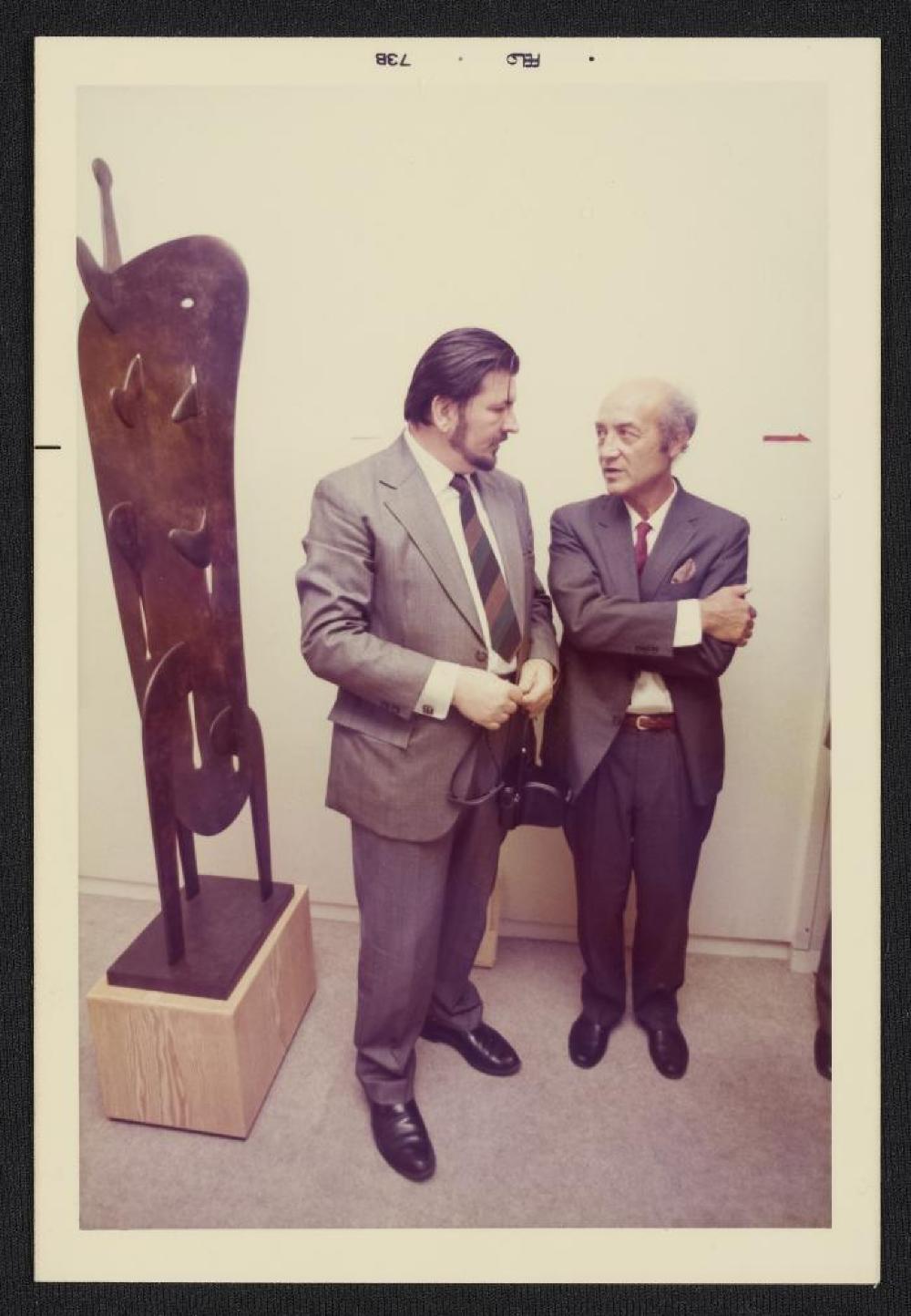 Noguchi with guest in front of Gregory, exhibition opening, Minami Gallery, 1973