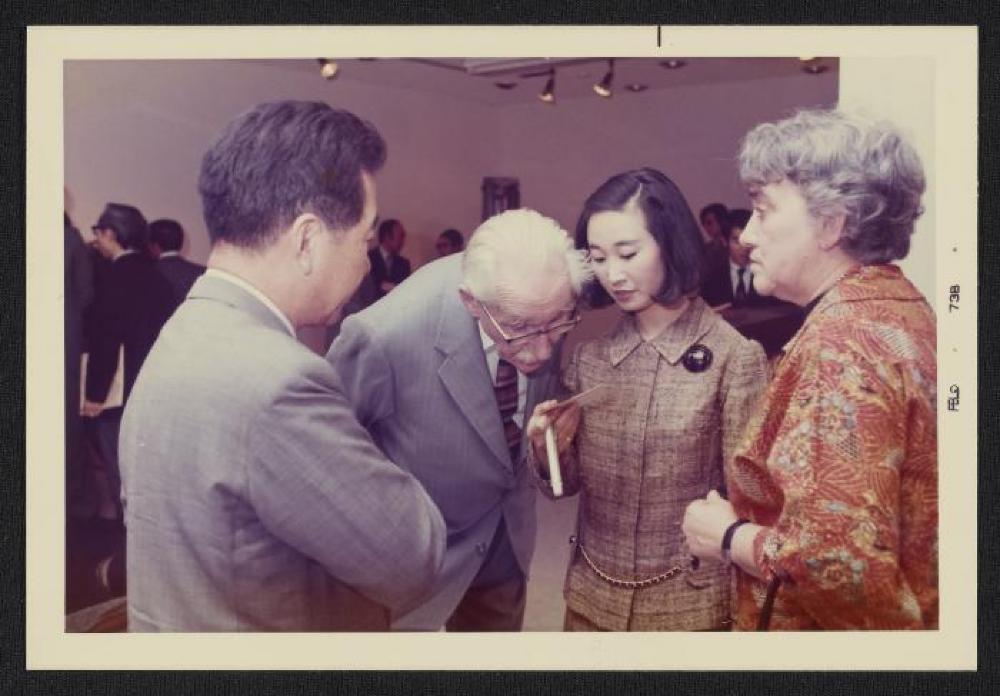Noguchi with Bernard Leach, Janet Leach, Mihoko Okamura and guests at exhibition opening, Minami Gallery, 1973