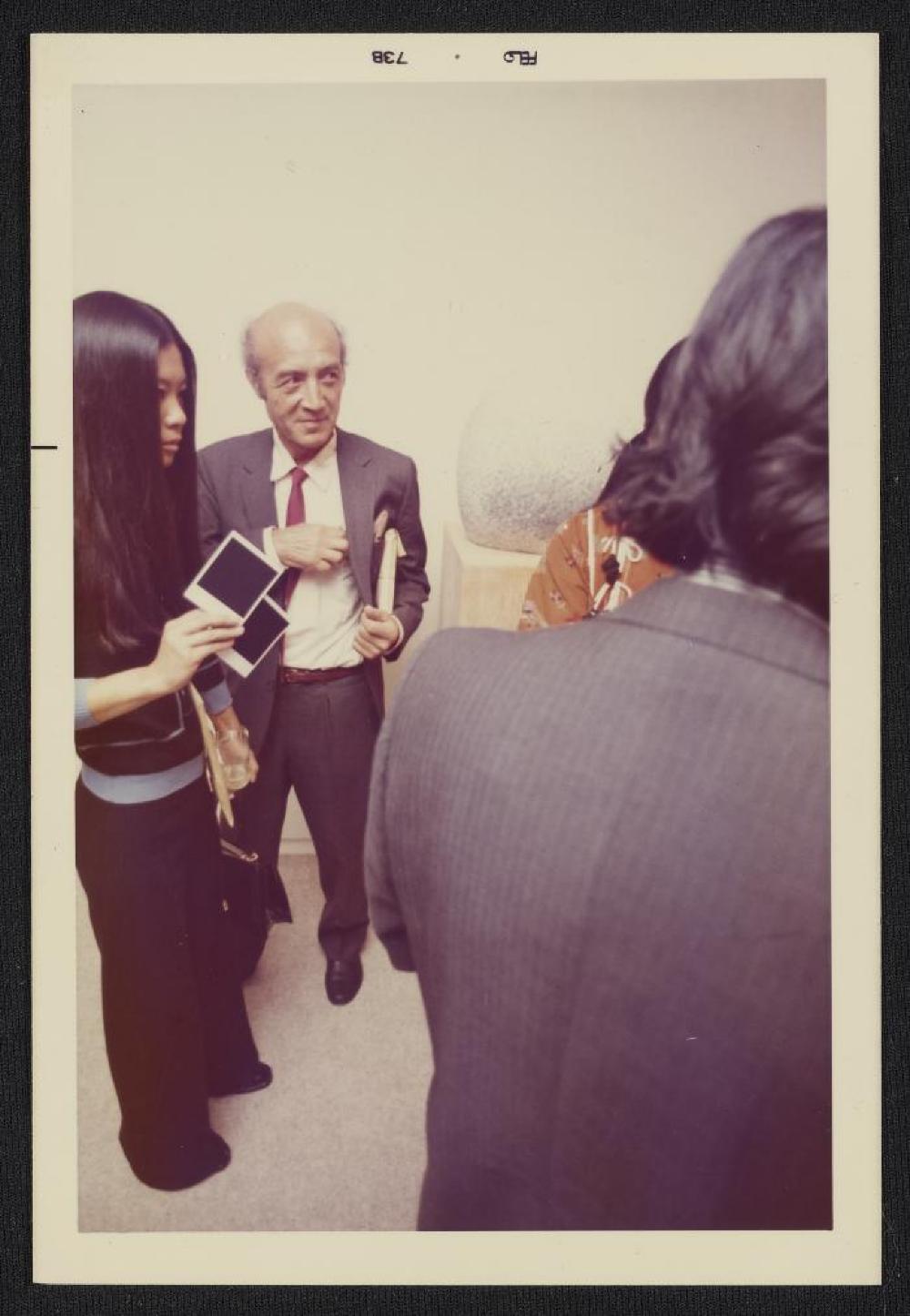 Noguchi with guests at exhibtion opening, Minami Gallery, 1973
