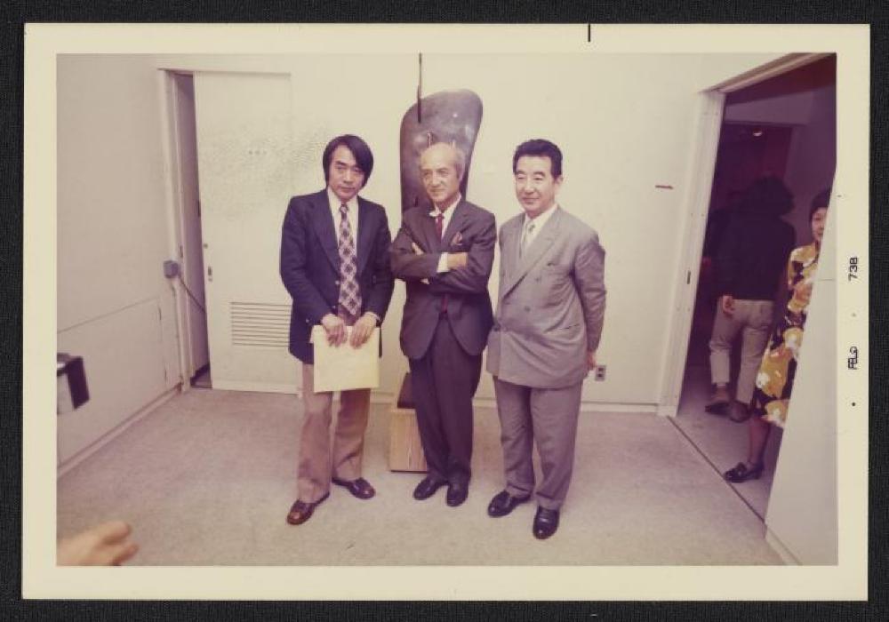 Noguchi with guests at exhibition opening, Minami Gallery, 1973