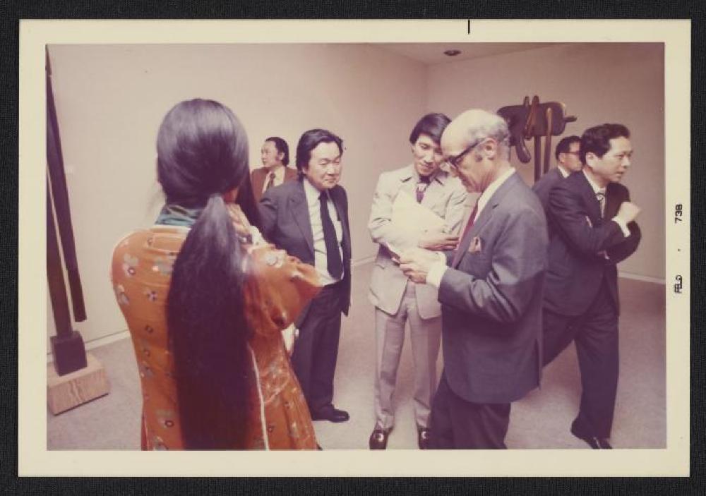 Noguchi with guests at exhibition opening, Minami Gallery, 1973