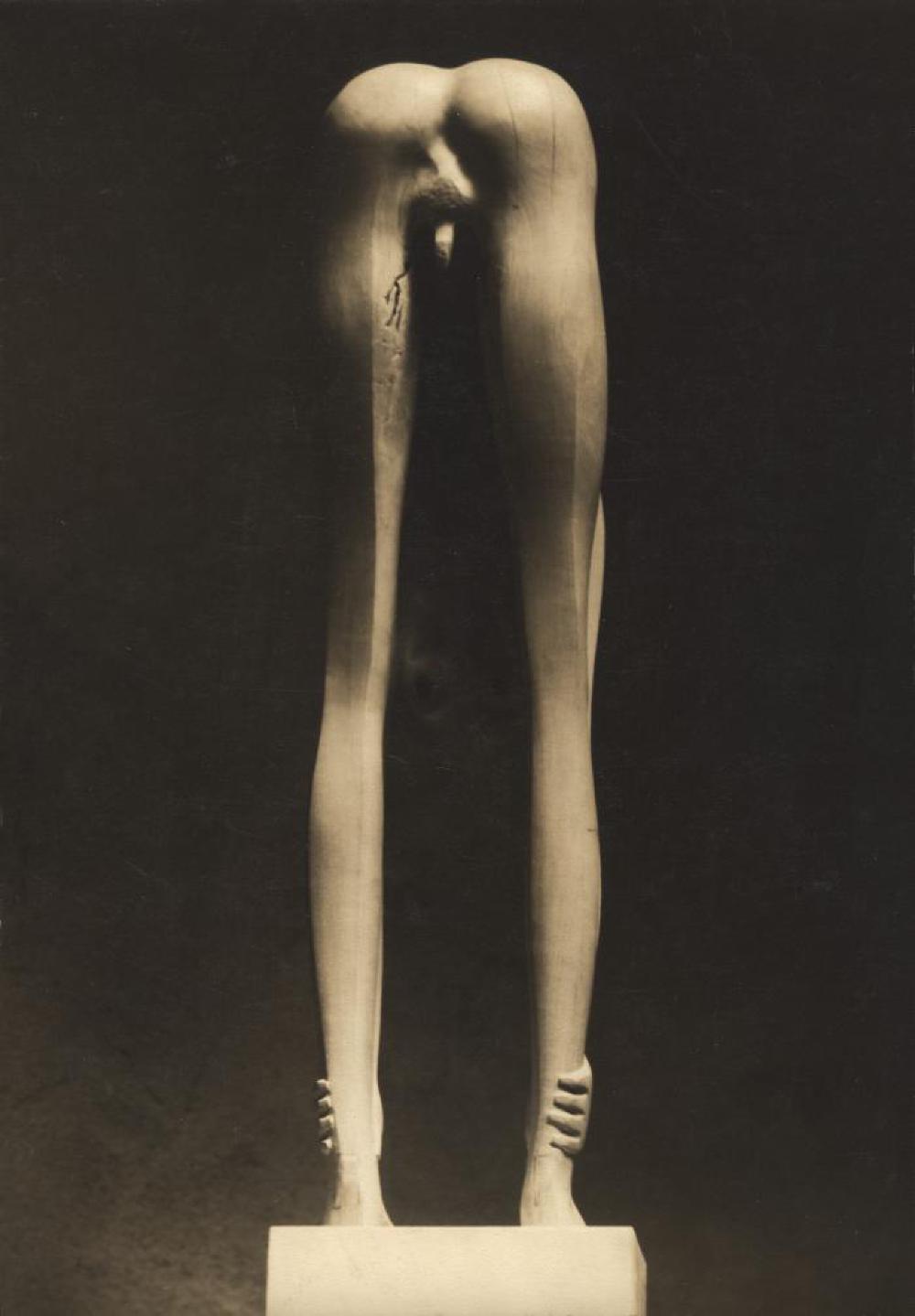 Boy Looking through Legs, image 3