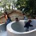 Children playing on Slide Mantra at Isamu Noguchi:  What is Sculpture?, 1986 Venice Biennale, June 29, 1986 - September 28, 1986.