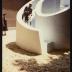 Isamu Noguchi testing his Slide Mantra as part of Isamu Noguchi: What is Sculpture? at the 1986 Venice Biennale
