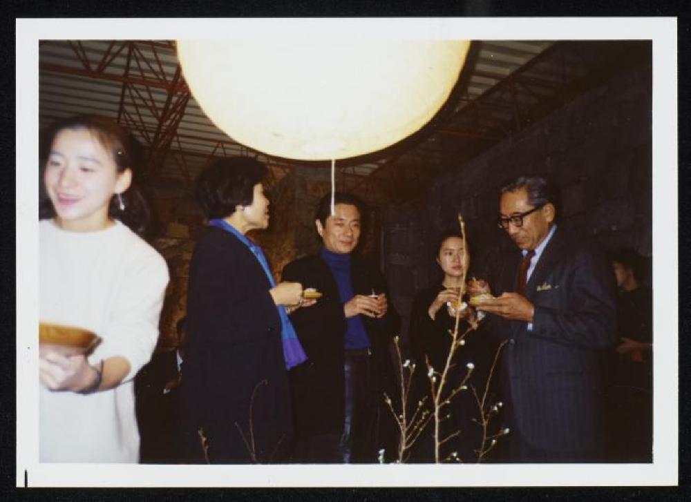 Shoji and Tsuneko Sadao with group at event for "Dear Heartfelt Friend, Isamu Noguchi," Marugame Genichiro-Inokuma Museum of Contemporary Art (MIMOCA) 